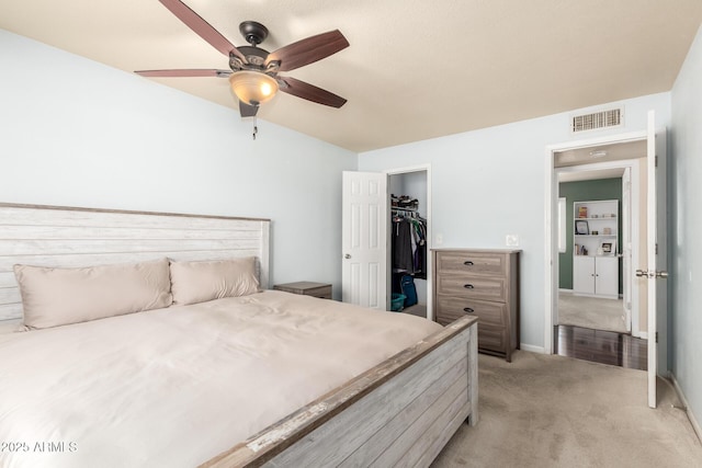 3415 E Anderson Dr, Phoenix, AZ 85032 - bedroom featuring light carpet, a spacious closet, a closet, and ceiling fan