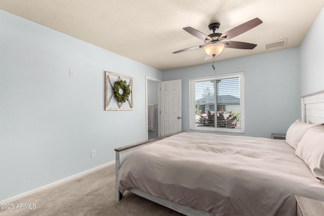 3415 E Anderson Dr, Phoenix, AZ 85032 - carpeted bedroom with baseboards, ceiling fan, and a textured ceiling