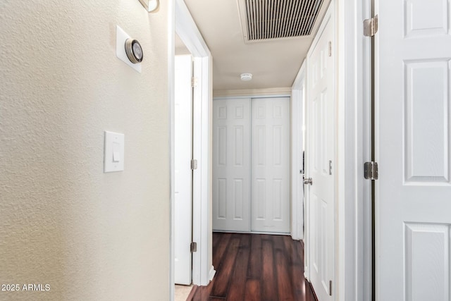 3415 E Anderson Dr, Phoenix, AZ 85032 - hall featuring a textured wall and dark wood-style flooring