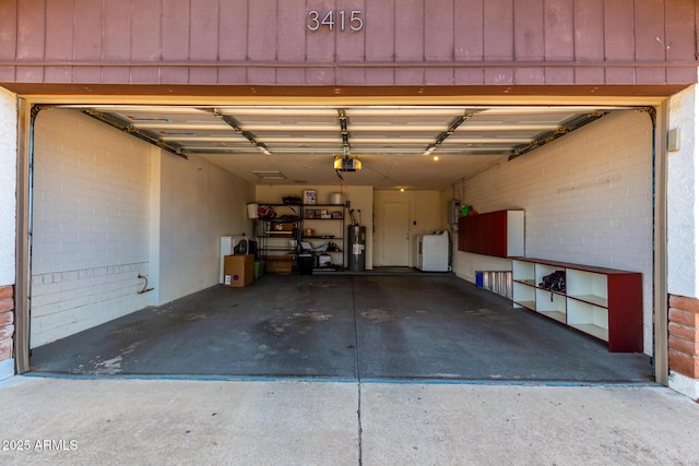 3415 E Anderson Dr, Phoenix, AZ 85032 - garage featuring washing machine and dryer, a garage door opener, and electric water heater