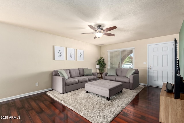 3415 E Anderson Dr, Phoenix, AZ 85032 - living area with ceiling fan, dark wood-style flooring, baseboards, and a textured ceiling
