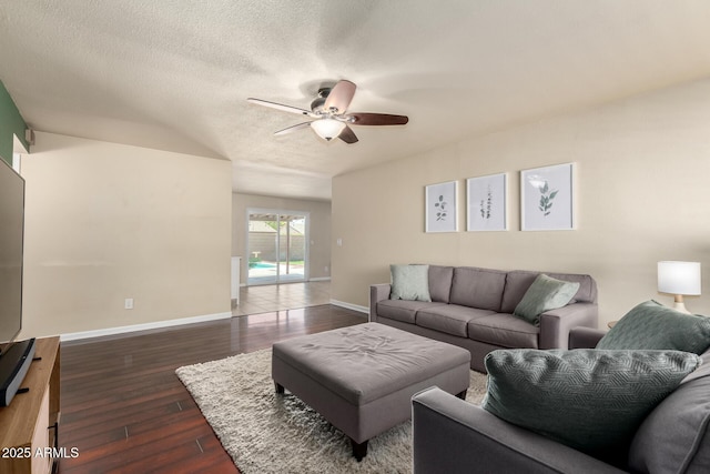 3415 E Anderson Dr, Phoenix, AZ 85032 - living area with ceiling fan, dark wood-style flooring, baseboards, and a textured ceiling