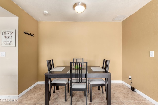 3415 E Anderson Dr, Phoenix, AZ 85032 - dining space with baseboards and light tile patterned floors