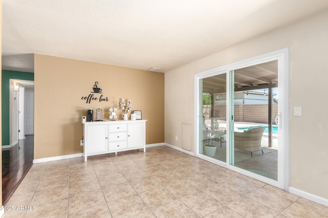 3415 E Anderson Dr, Phoenix, AZ 85032 - spare room featuring baseboards and light tile patterned flooring