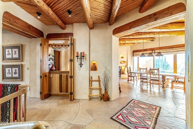 hallway with wood ceiling and beamed ceiling