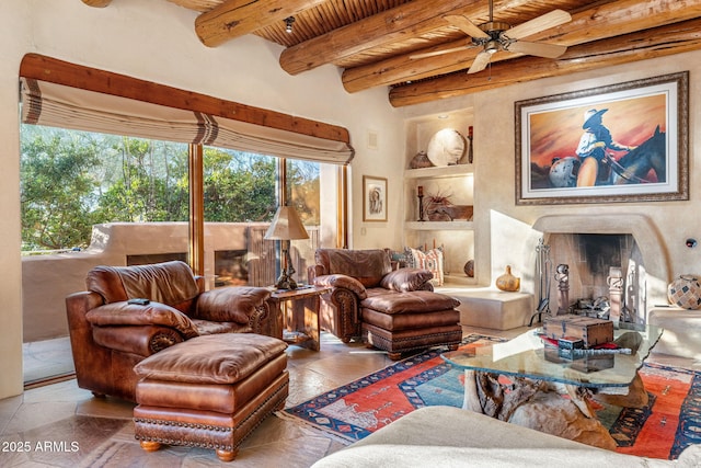 living room with built in features, ceiling fan, a high end fireplace, wooden ceiling, and beam ceiling