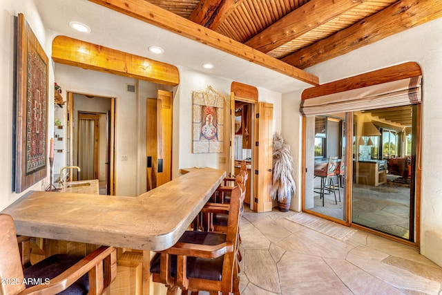 dining room featuring beam ceiling