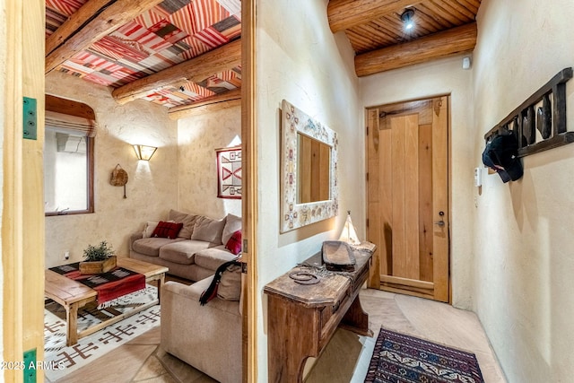 interior space featuring beamed ceiling and wooden ceiling