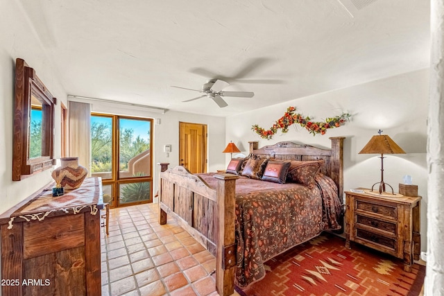 bedroom featuring ceiling fan and access to exterior