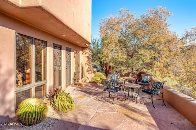 view of patio / terrace with a balcony