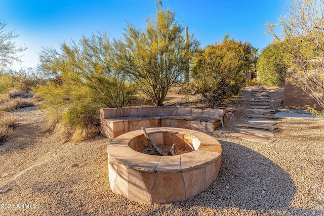 view of yard with an outdoor fire pit