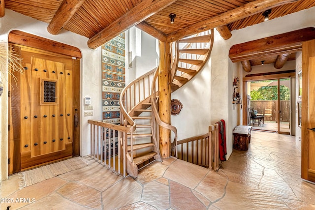 entryway featuring wood ceiling and beamed ceiling