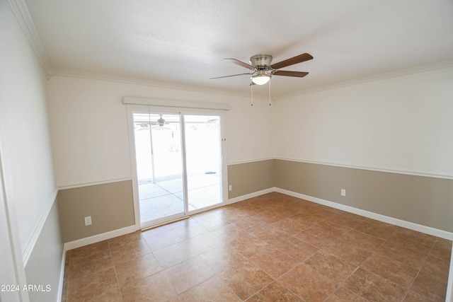 spare room with ornamental molding and ceiling fan