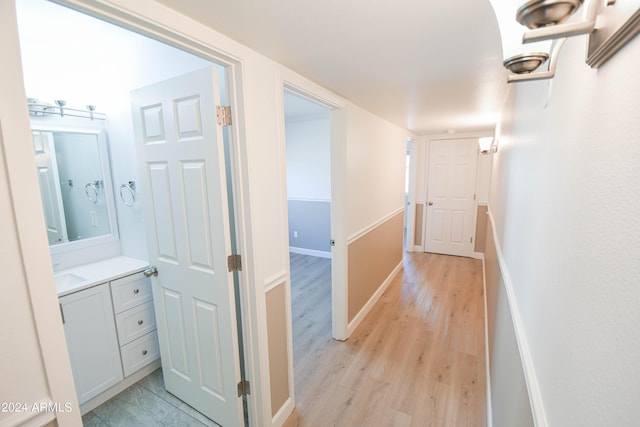 corridor featuring light wood-type flooring