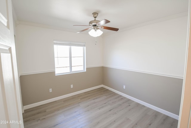 empty room with ornamental molding, light hardwood / wood-style floors, and ceiling fan