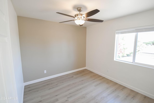 unfurnished room with ceiling fan and light hardwood / wood-style floors