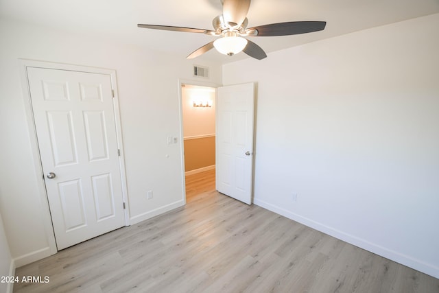 unfurnished bedroom featuring ceiling fan and light hardwood / wood-style floors