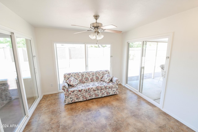 living area with plenty of natural light and ceiling fan