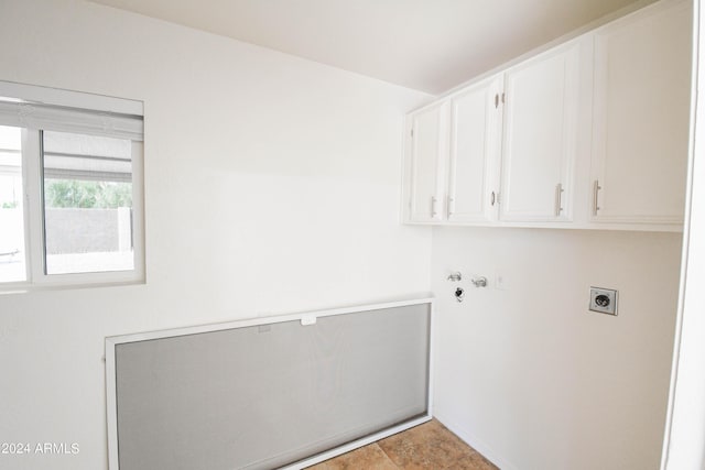 laundry area featuring cabinets and hookup for an electric dryer