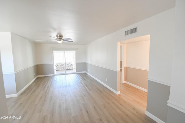 unfurnished room featuring ceiling fan and light wood-type flooring