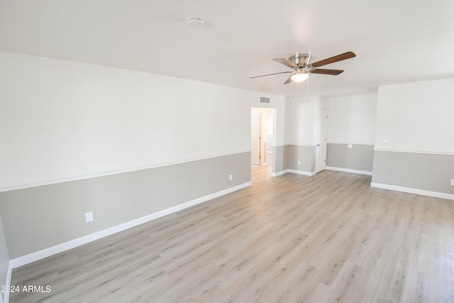 empty room featuring ceiling fan and light wood-type flooring