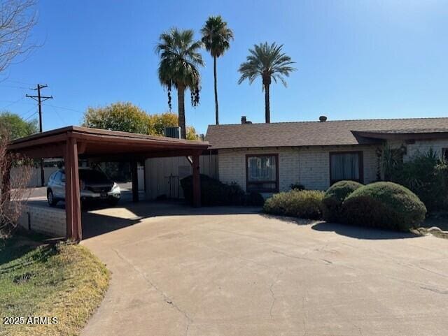 ranch-style home with a carport