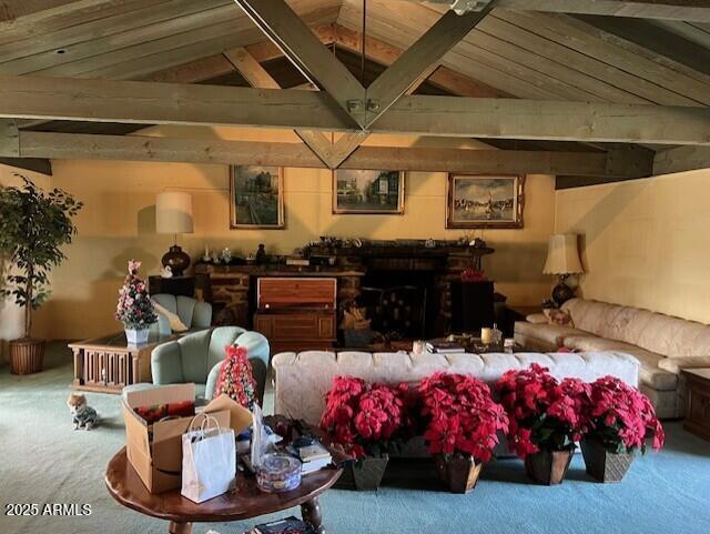 carpeted living room featuring wooden ceiling and lofted ceiling with beams