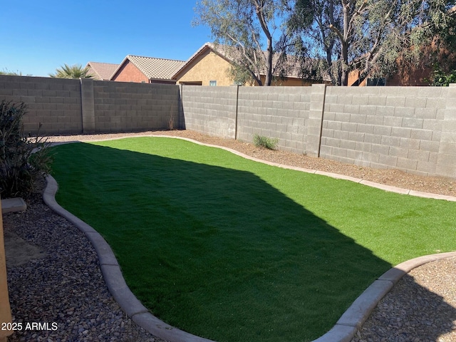 view of yard featuring a fenced backyard