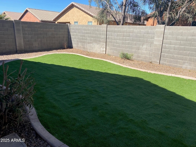 view of yard featuring a fenced backyard