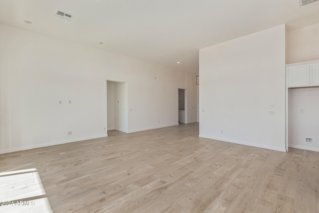 unfurnished room featuring light hardwood / wood-style floors