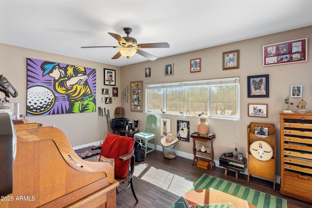 home office with baseboards, a ceiling fan, and wood finished floors