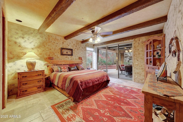 bedroom with beam ceiling and access to outside