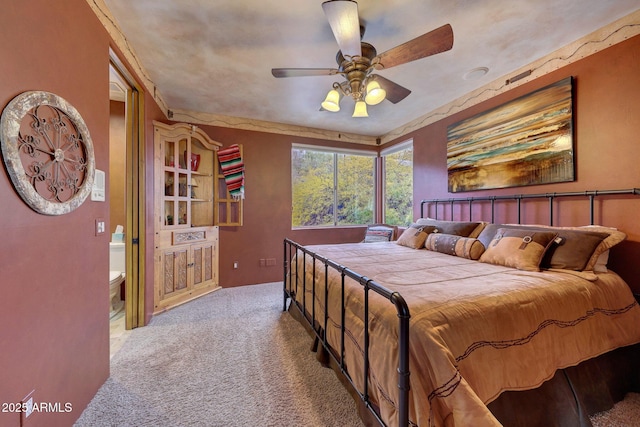 bedroom with light colored carpet and ceiling fan