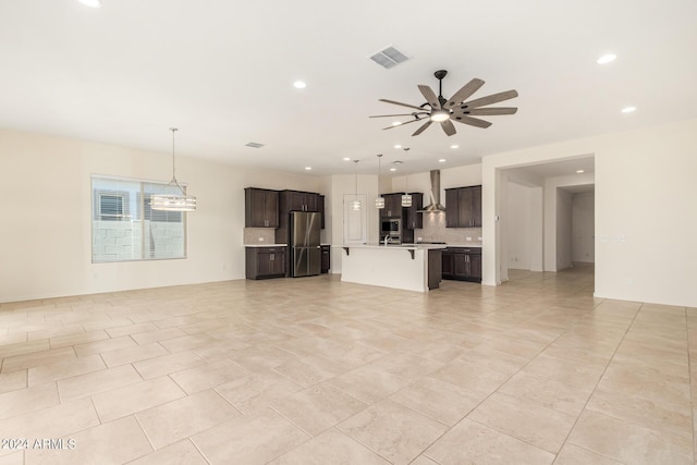 unfurnished living room featuring ceiling fan and light tile patterned flooring