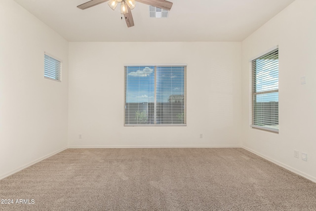 carpeted empty room with ceiling fan