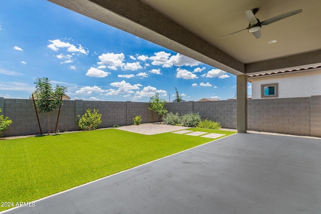 view of yard featuring ceiling fan and a patio area