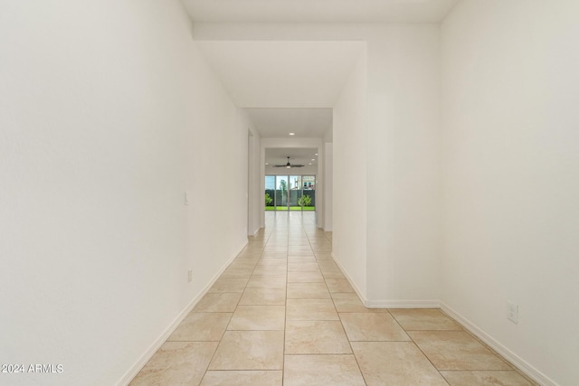 hall featuring light tile patterned flooring