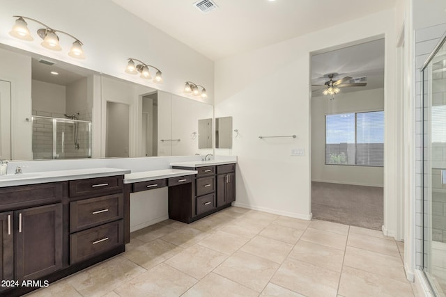 bathroom with ceiling fan, tile patterned floors, vanity, and a shower with shower door