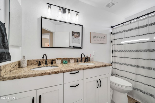 bathroom with hardwood / wood-style flooring, vanity, toilet, and a shower with shower curtain