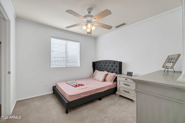 bedroom featuring ceiling fan, light colored carpet, and ornamental molding