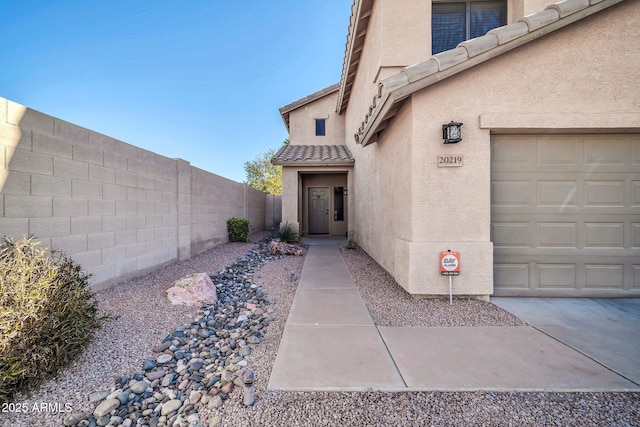 entrance to property featuring a garage