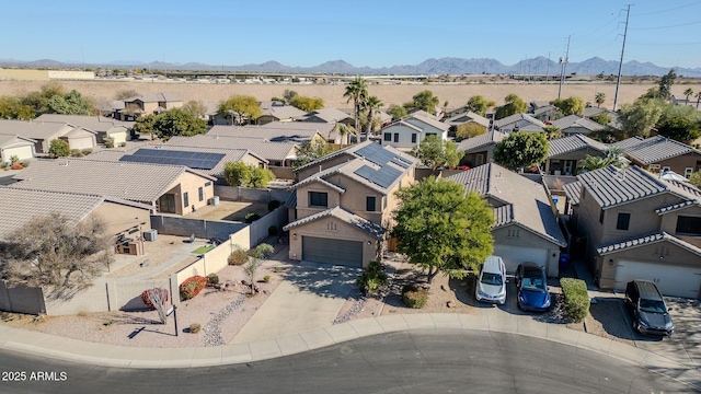 birds eye view of property featuring a mountain view