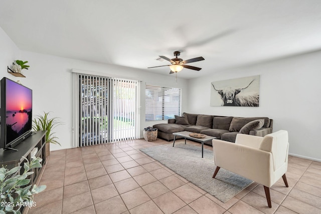 living room with ceiling fan and light tile patterned floors