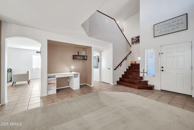 view of carpeted entrance foyer