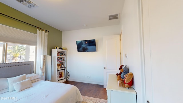 bedroom featuring wood-type flooring