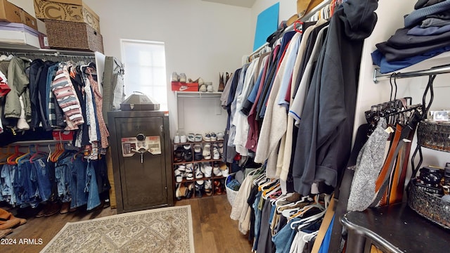 spacious closet featuring dark hardwood / wood-style floors