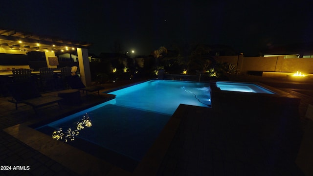 pool at twilight with a pergola, an in ground hot tub, and a patio