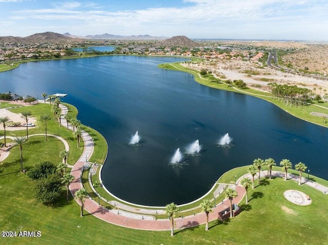 drone / aerial view with a water and mountain view