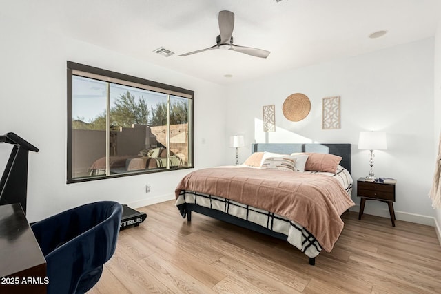 bedroom featuring ceiling fan and light hardwood / wood-style floors