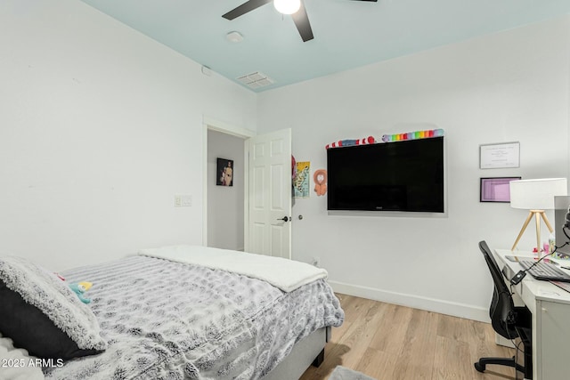 bedroom with ceiling fan and light wood-type flooring